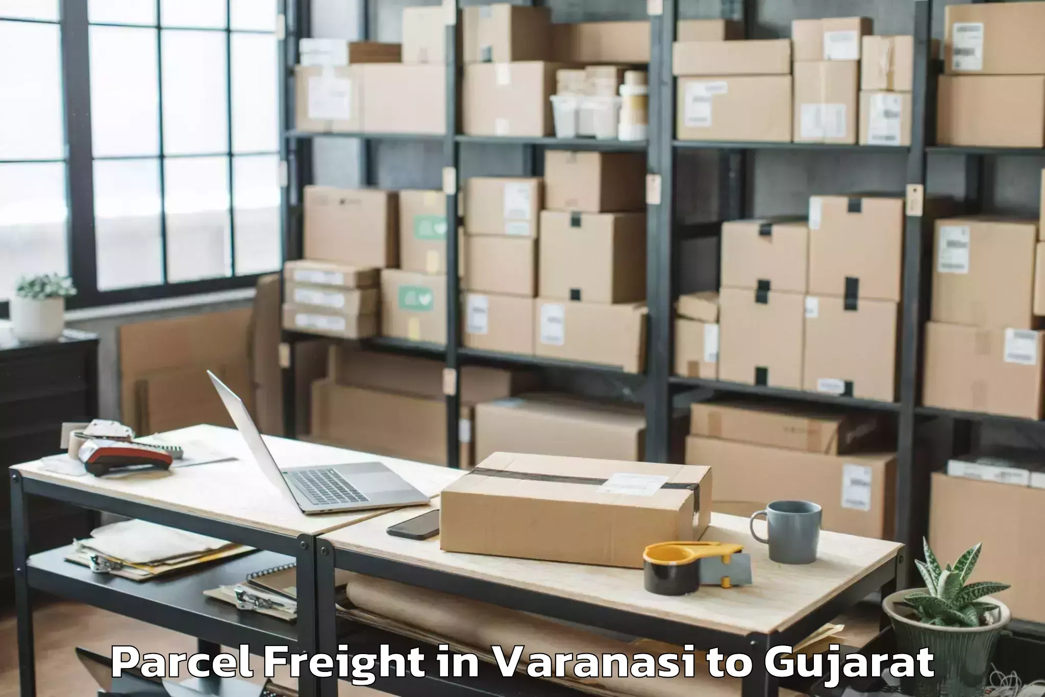 Book Varanasi to Khambhaliya Parcel Freight Online